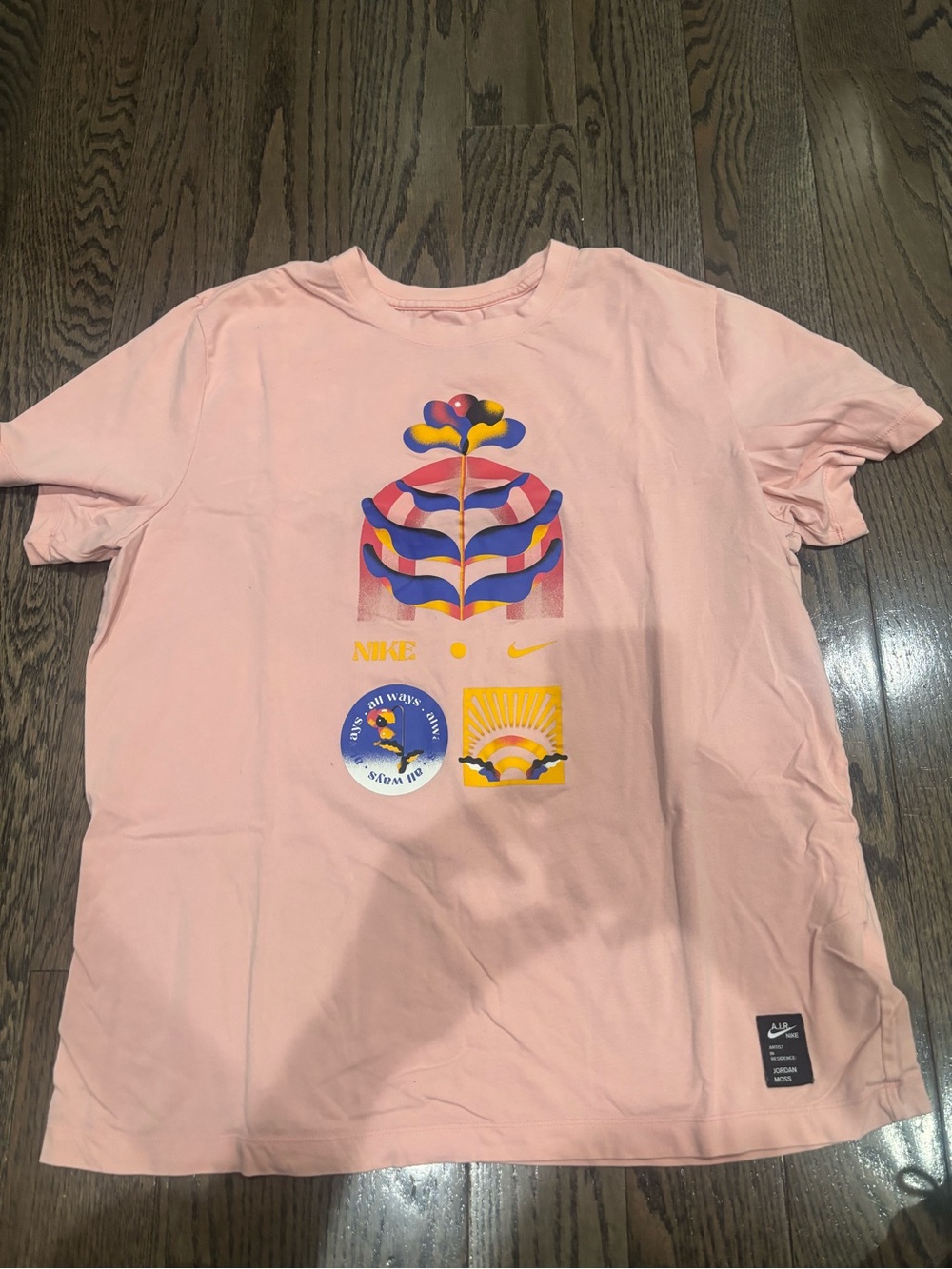 Nike Pink Graphic Tee with Multicolor Print